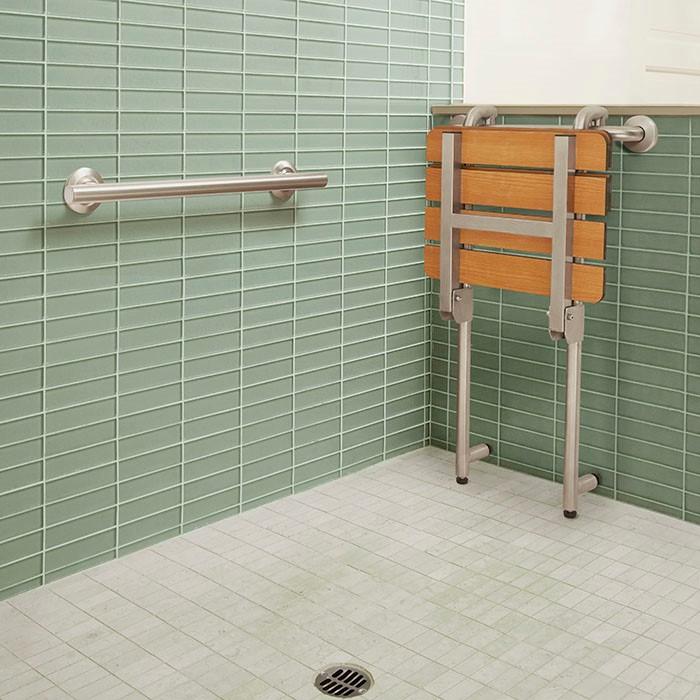 https://www.freedomshowers.com/image/cache/data/APFSSGBH-180160PT-profile-Freedom-shower-bench-with-grab-bar-folded-up-in-barrier-free-shower-700x700.jpg