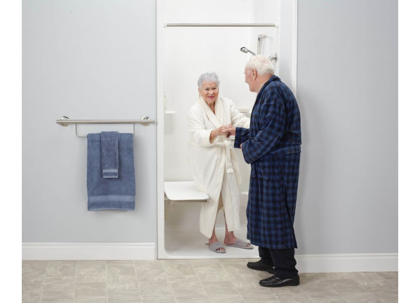 Senior woman sitting up from Wall Supported ADA Shower Seat