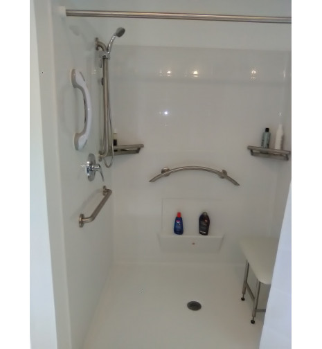 new Freedom Accessible Shower with crescent grab bar and accessories.   