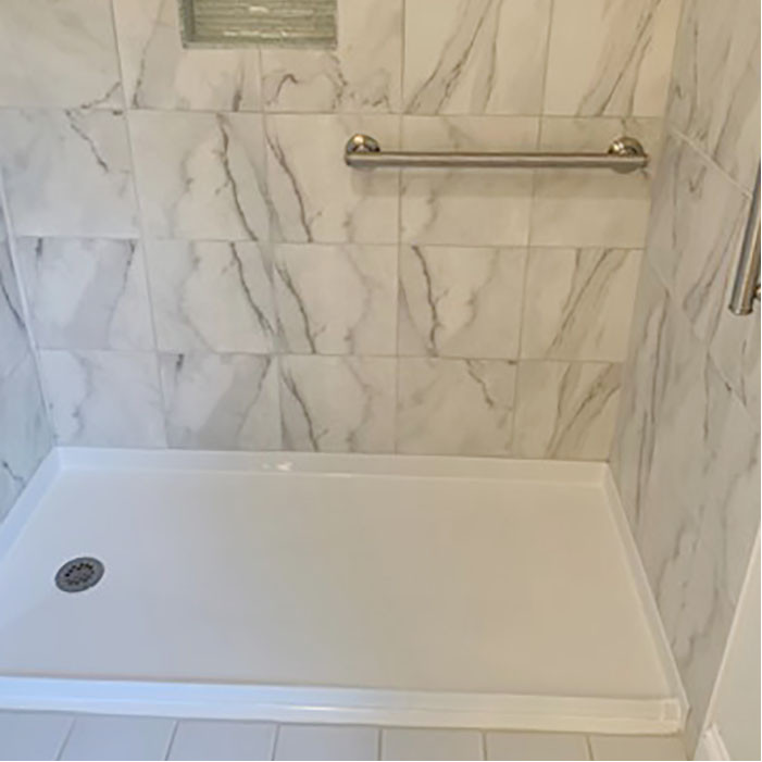 curb free shower pan with tiled walls