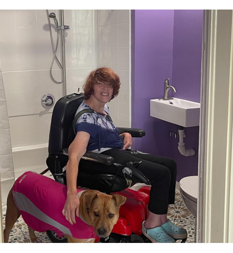 service dog helps with Freedom Shower